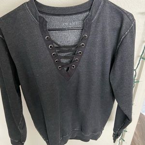 Distressed crisscross crew neck